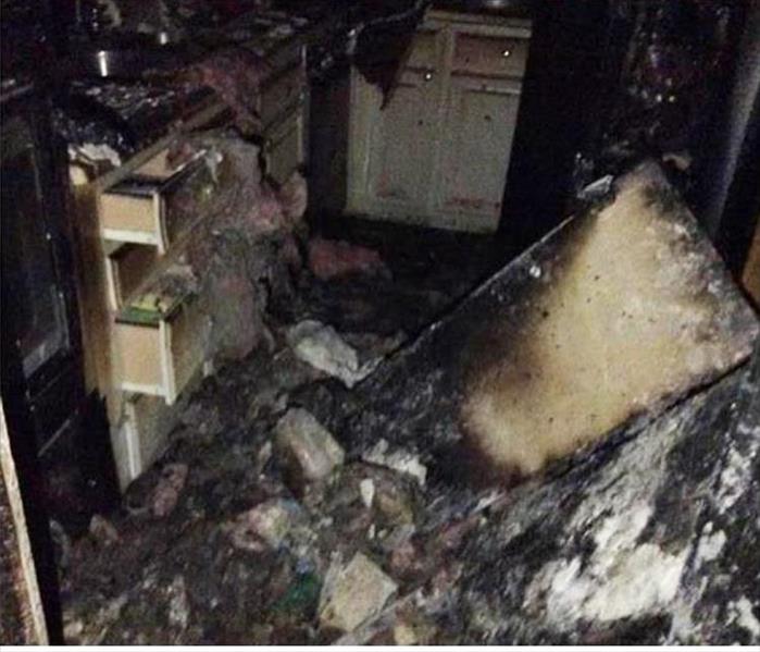 burned and debris filled kitchen