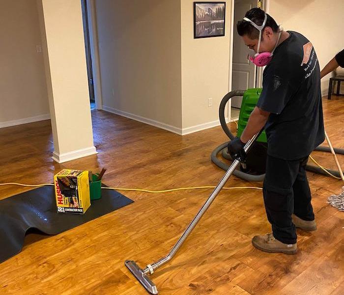SERVPRO technician with water removal equipment