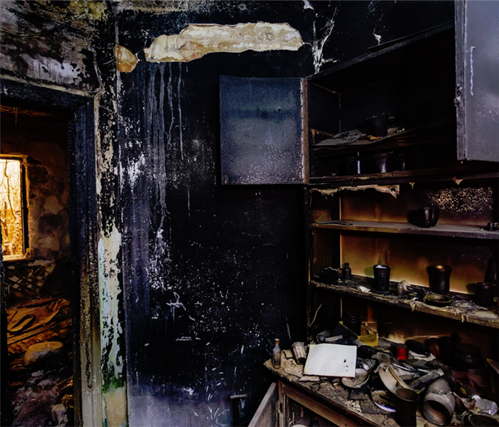 burnt kitchen interior with a cabinet burnt