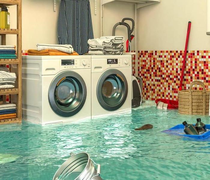 A flooded room with appliances partially under water
